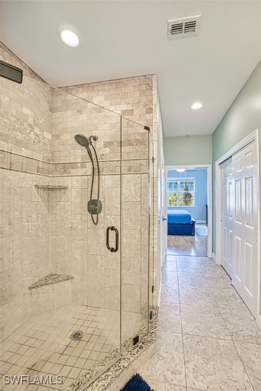 full bath with a shower stall, recessed lighting, and visible vents