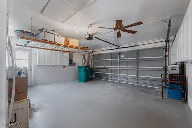garage featuring a garage door opener and electric panel