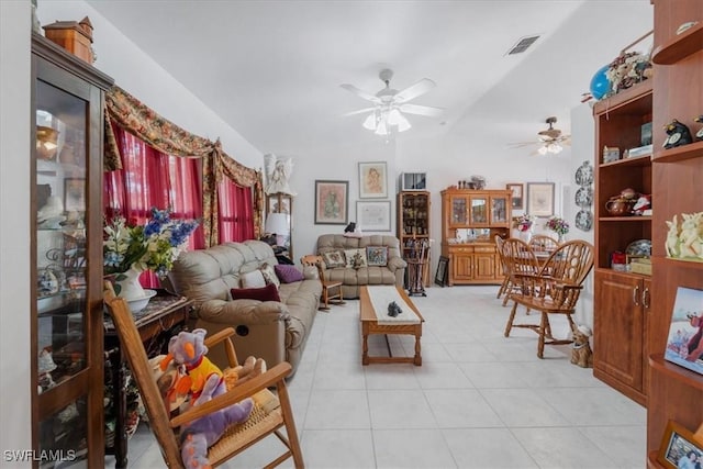 living area with light tile patterned flooring, ceiling fan, and visible vents
