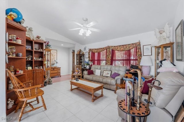 living area featuring ceiling fan and lofted ceiling