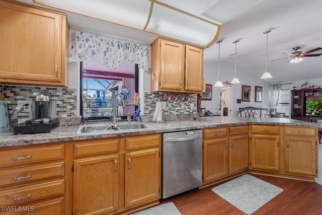 kitchen with a sink, dark wood-style flooring, a peninsula, and dishwasher