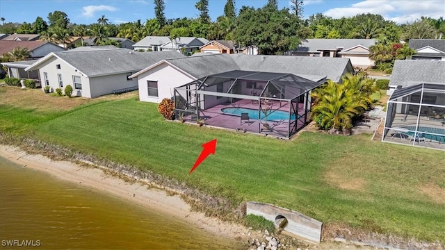 drone / aerial view with a residential view and a water view