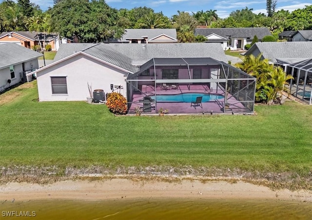 back of property featuring a lanai, an outdoor pool, a yard, a patio, and stucco siding