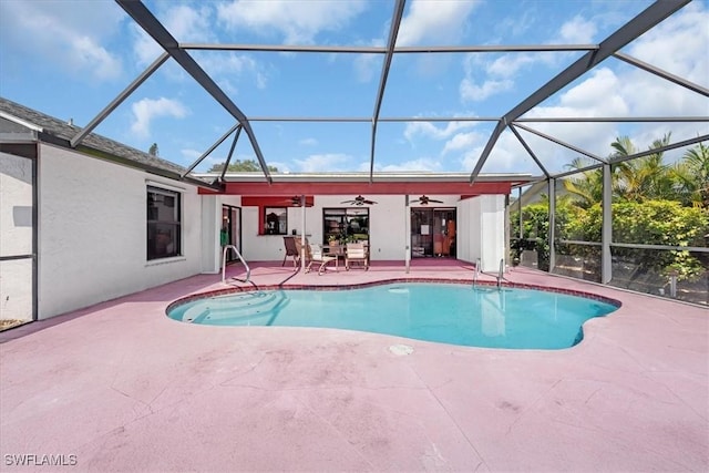 pool featuring a lanai, a ceiling fan, and a patio area