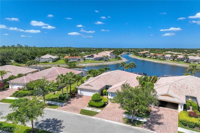 bird's eye view featuring a water view and a residential view
