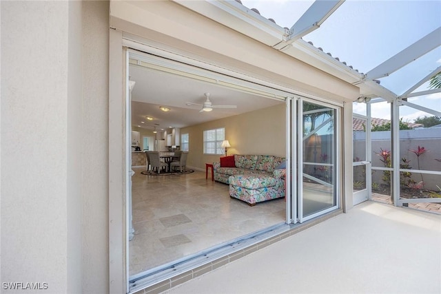 view of patio / terrace featuring a lanai
