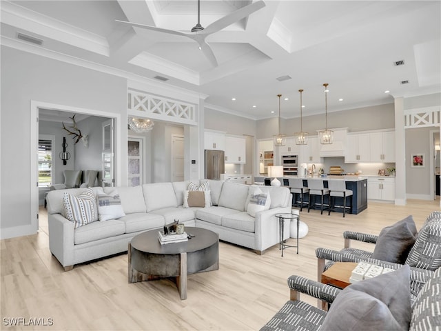 14243 Galley Ct, Naples, FL 34114 - living room featuring crown molding, visible vents, ceiling fan with notable chandelier, and coffered ceiling