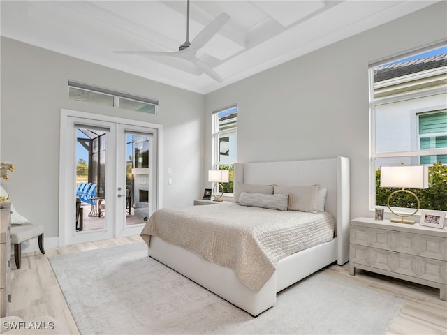 14243 Galley Ct, Naples, FL 34114 - bedroom with access to exterior, french doors, a ceiling fan, wood finished floors, and coffered ceiling