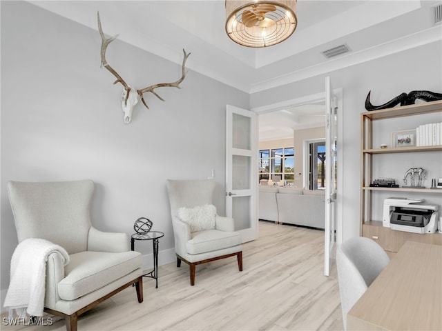 14243 Galley Ct, Naples, FL 34114 - sitting room with wood finished floors and visible vents