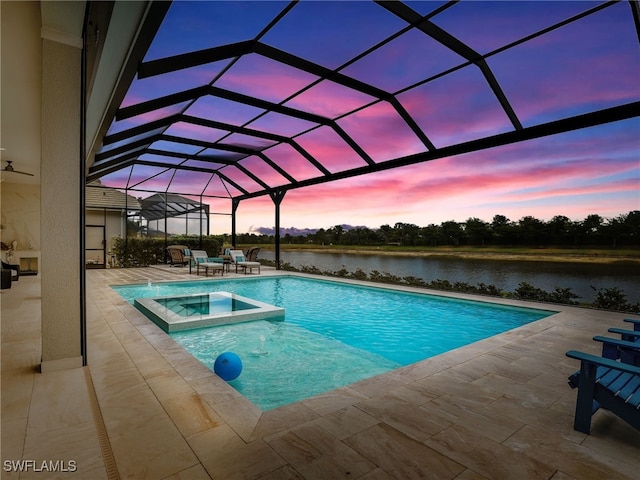 14243 Galley Ct, Naples, FL 34114 - view of pool with glass enclosure, a water view, a pool with connected hot tub, and a patio area