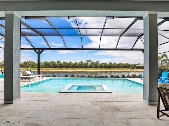 14243 Galley Ct, Naples, FL 34114 - view of pool featuring a patio, a water view, glass enclosure, and a pool with connected hot tub