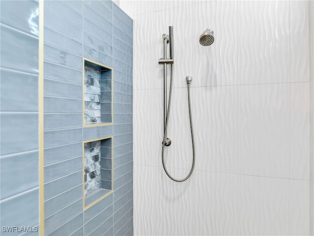 14243 Galley Ct, Naples, FL 34114 - full bath featuring a fireplace and tiled shower