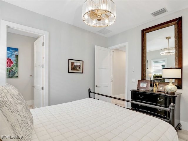 14243 Galley Ct, Naples, FL 34114 - bedroom with baseboards, a chandelier, and visible vents