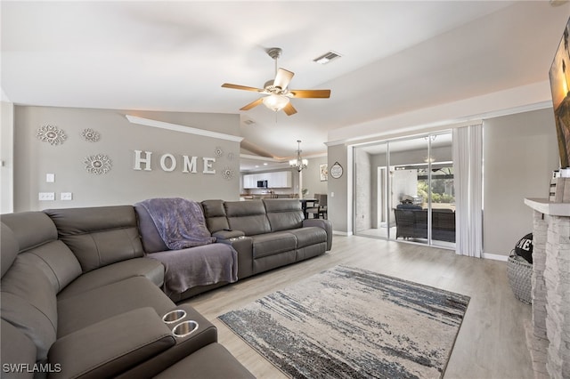 living area with a ceiling fan, lofted ceiling, wood finished floors, a chandelier, and baseboards