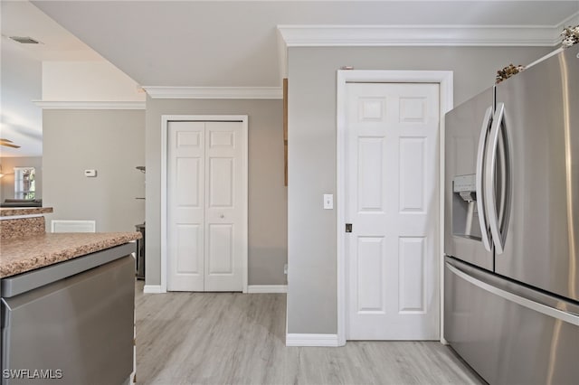 kitchen featuring stainless steel fridge, light wood-type flooring, crown molding, baseboards, and light countertops