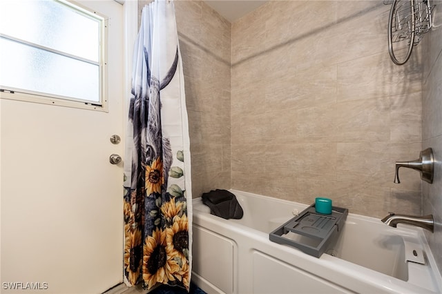 bathroom featuring shower / bath combo with shower curtain