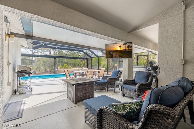 view of patio / terrace featuring an outdoor pool, a lanai, outdoor lounge area, and a grill