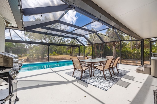 swimming pool with a patio area and outdoor dining space