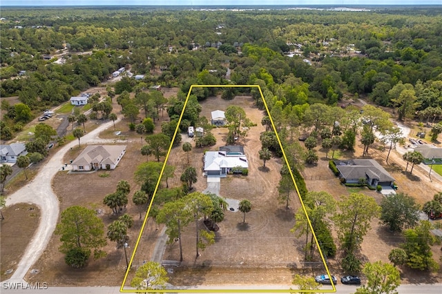 aerial view of property's location with a forest and property boundaries highlighted