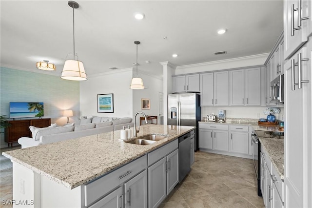 kitchen with a sink, gray cabinets, crown molding, and stainless steel appliances