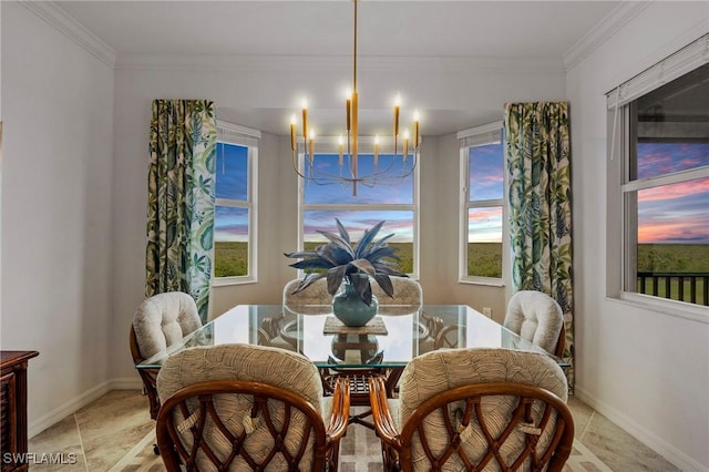 dining room with baseboards, ornamental molding, and a chandelier