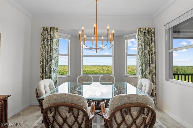 dining area featuring baseboards, a chandelier, and ornamental molding