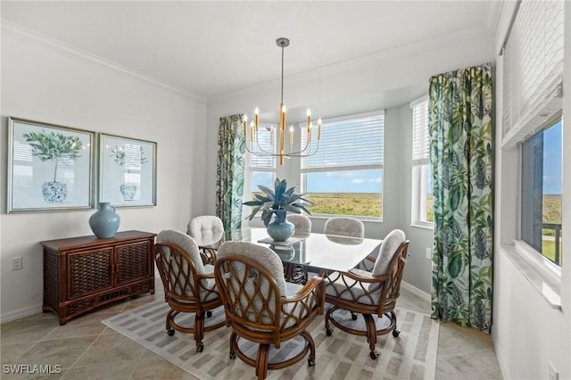 dining area with crown molding, baseboards, a chandelier, and plenty of natural light