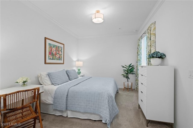 carpeted bedroom featuring baseboards and ornamental molding