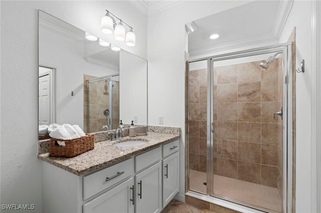 bathroom featuring crown molding, a stall shower, and vanity