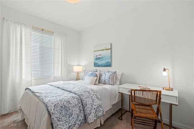 carpeted bedroom with baseboards
