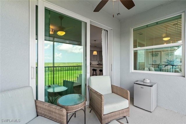 exterior space featuring a ceiling fan