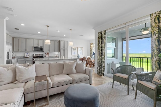 living area featuring visible vents, ornamental molding, light tile patterned flooring, ceiling fan, and recessed lighting