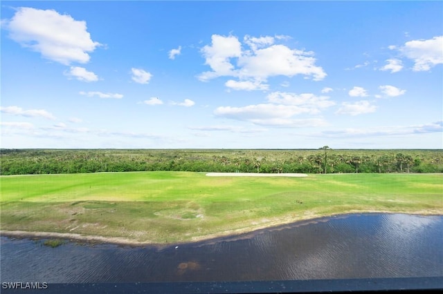 exterior space featuring view of golf course and a water view