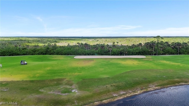 surrounding community with a water view and view of golf course