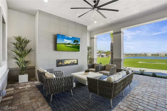 view of patio with ceiling fan and outdoor lounge area