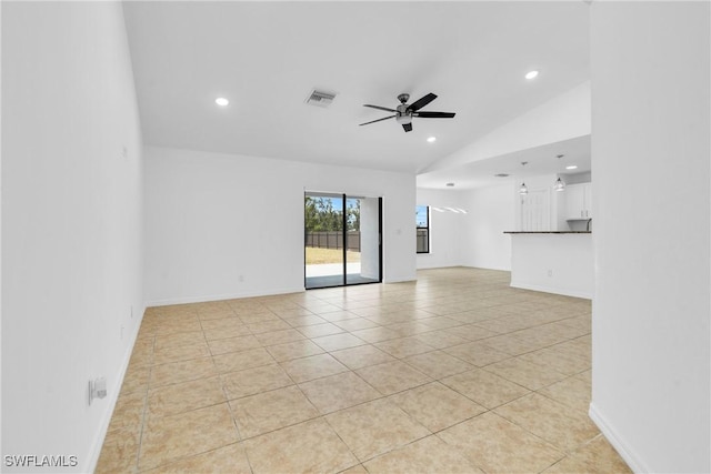 unfurnished living room with lofted ceiling, light tile patterned flooring, visible vents, and recessed lighting