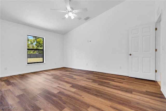 unfurnished room with wood finished floors, visible vents, vaulted ceiling, ceiling fan, and baseboards