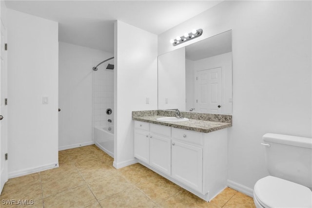 bathroom featuring shower / bathing tub combination, toilet, vanity, tile patterned floors, and baseboards