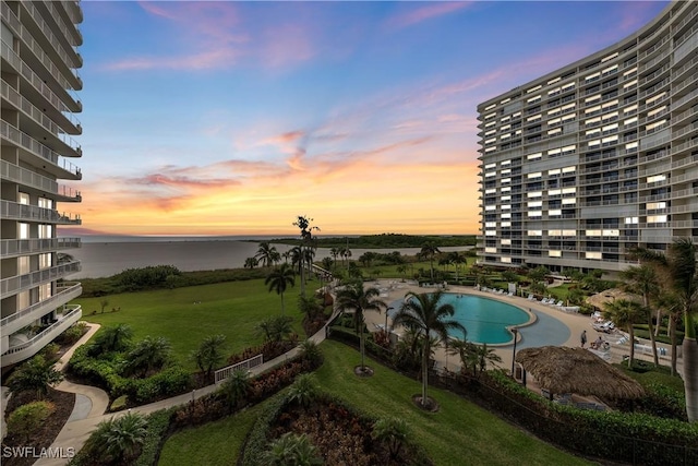 260 Seaview Ct Unit 402, Marco Island, FL 34145 - view of swimming pool with a water view and a yard