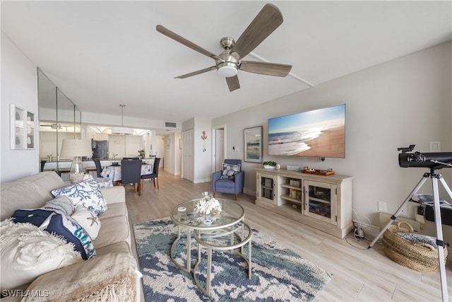260 Seaview Ct Unit 402, Marco Island, FL 34145 - living room featuring baseboards, ceiling fan, visible vents, and wood finished floors