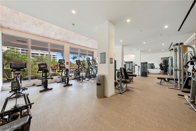 260 Seaview Ct Unit 402, Marco Island, FL 34145 - workout area featuring plenty of natural light, recessed lighting, and light carpet
