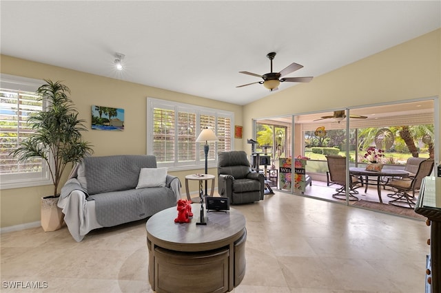 4748 San Carlo Ct, Naples, FL 34109 - living room with lofted ceiling, baseboards, a ceiling fan, and plenty of natural light