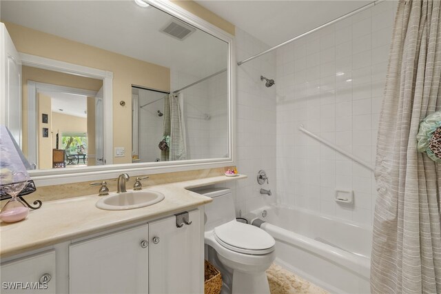4748 San Carlo Ct, Naples, FL 34109 - bathroom with vanity, toilet, visible vents, and shower / bath combo