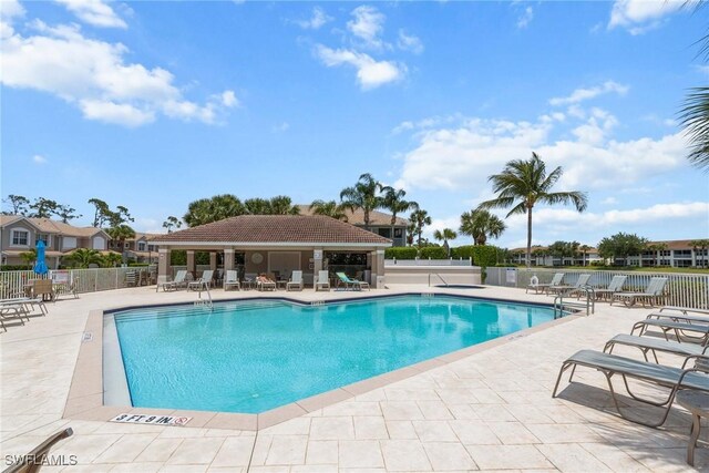 11016 Mill Creek Way Unit 2403, Fort Myers, FL 33913 - community pool featuring fence and a patio area
