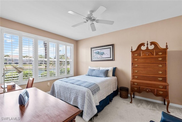 11016 Mill Creek Way Unit 2403, Fort Myers, FL 33913 - bedroom with light carpet, baseboards, and ceiling fan
