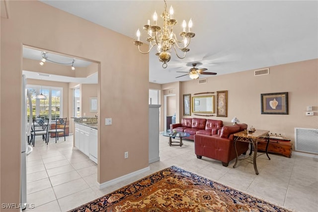11016 Mill Creek Way Unit 2403, Fort Myers, FL 33913 - living room featuring light tile patterned floors, a ceiling fan, baseboards, and a chandelier