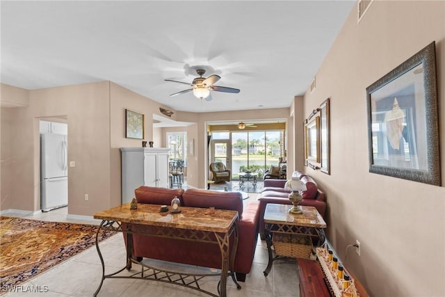 11016 Mill Creek Way Unit 2403, Fort Myers, FL 33913 - living room with light tile patterned flooring, ceiling fan, and baseboards