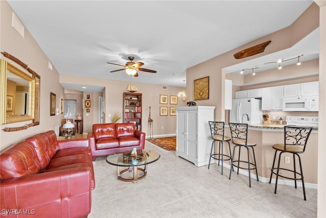11016 Mill Creek Way Unit 2403, Fort Myers, FL 33913 - living room featuring a ceiling fan, light tile patterned floors, and baseboards