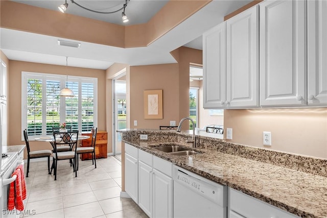 11016 Mill Creek Way Unit 2403, Fort Myers, FL 33913 - kitchen with white appliances, a sink, white cabinetry, and light stone countertops