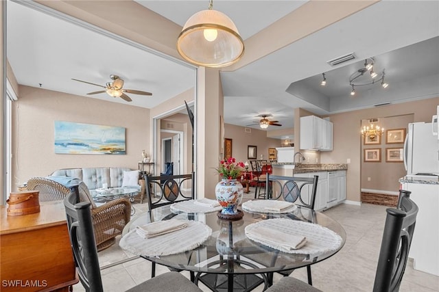 11016 Mill Creek Way Unit 2403, Fort Myers, FL 33913 - dining area with a ceiling fan, light tile patterned floors, baseboards, and a tray ceiling